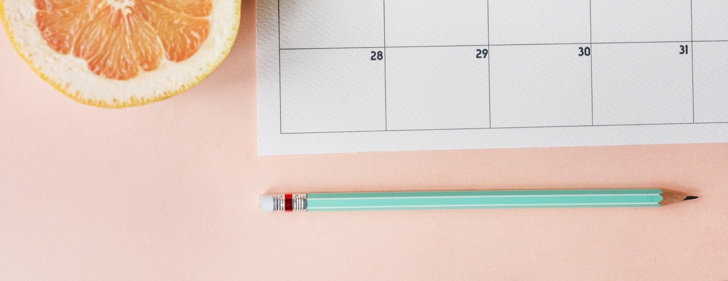 A calendar with a pencil to take notes on when to prep your house for sale.