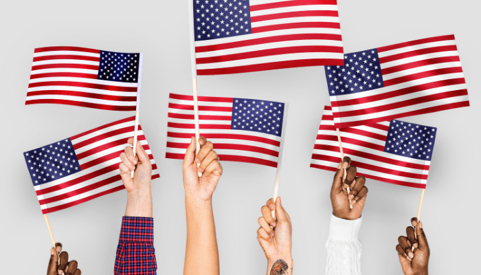 People holding flags on July Fourth.